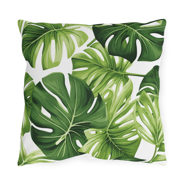 Pillow with green leaf monstera pattern on a white background